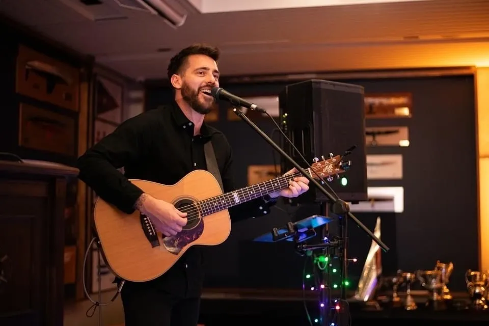 James Van corporate event musician Auckland performing live with band
