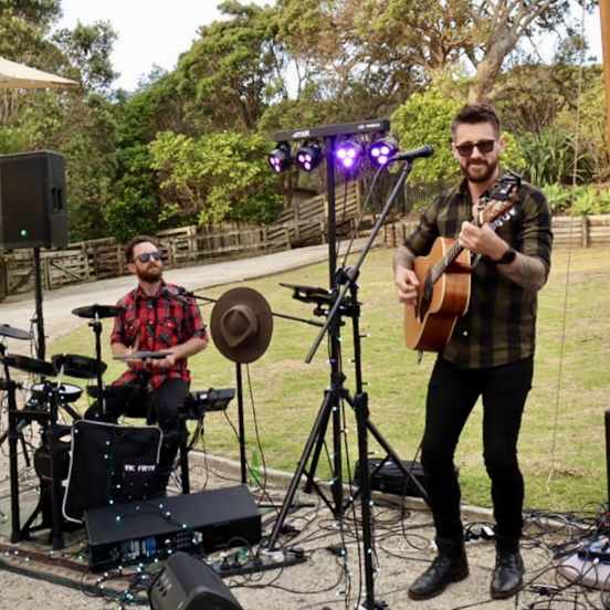Full Send duo performing outdoors at an Auckland corporate event